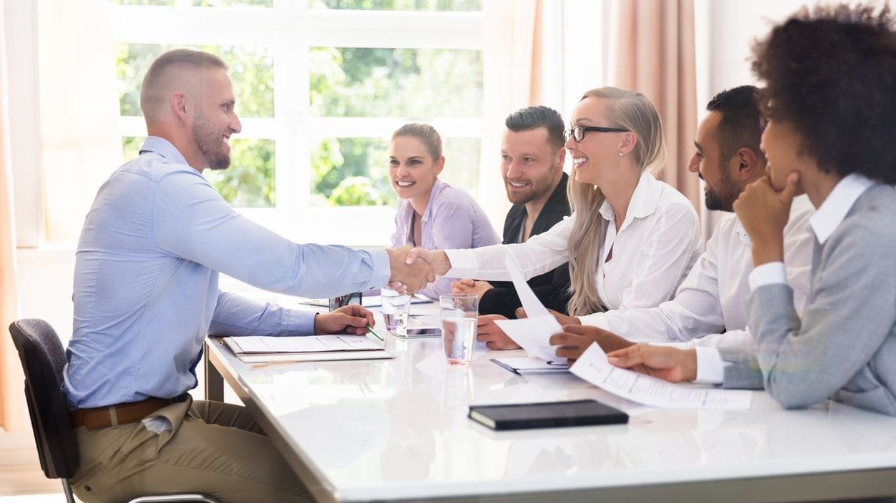 Diverse interview panel scheduling showing inclusive hiring practices